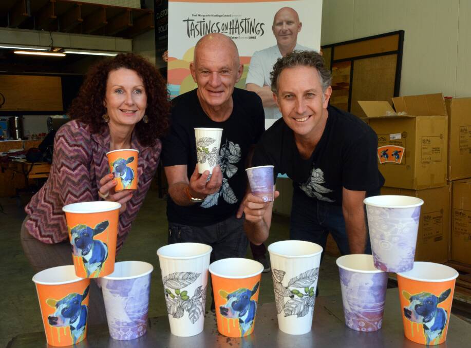 Your design could be here: Tastings on Hastings event coordinator Necia Waghorn, Port Macquarie artist Jim Matinos holding his Coffee design for series 3 of the BioCup Art Series, and local distributor Stewart Clark of Doppio or Nothing.