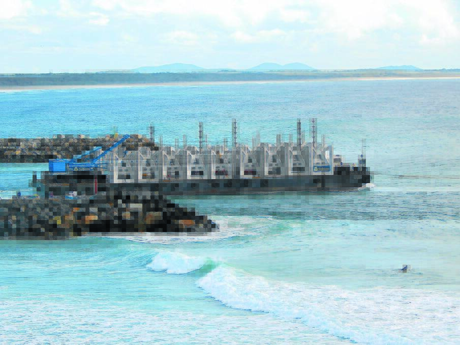 Heading out: The Port Macquarie OAR (Offshore Artificial Reef) modules being towed out for deployment earlier this week.