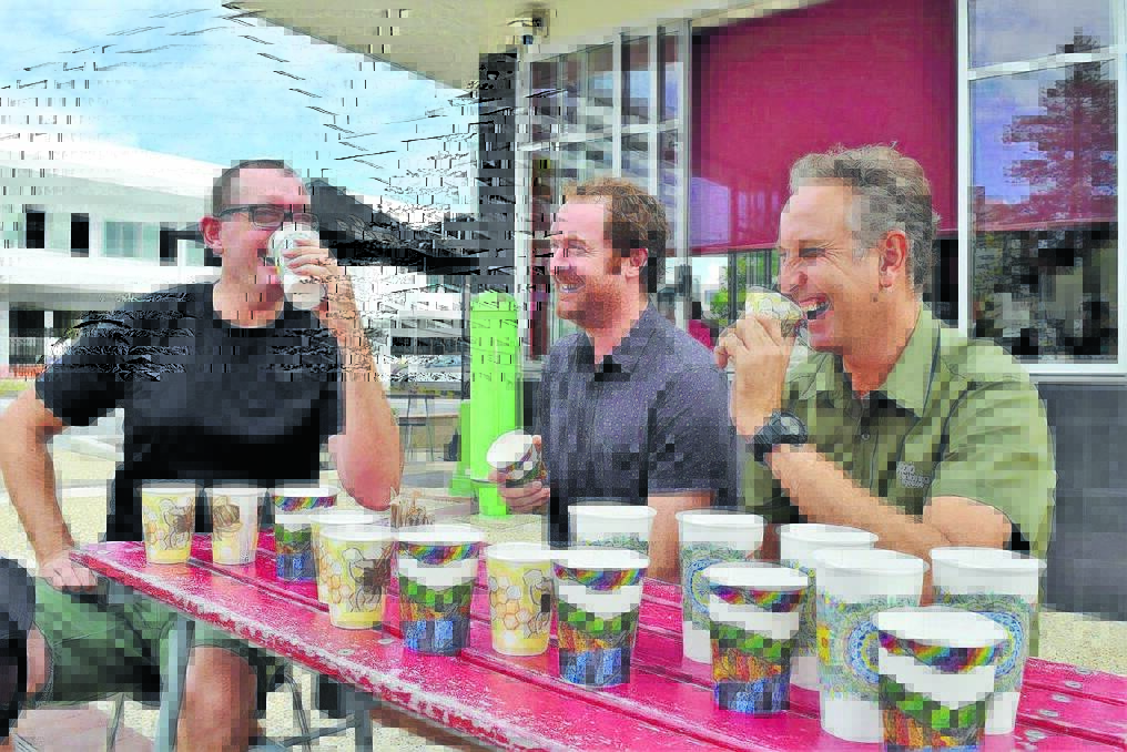 Coffee with art: BioCup Art Series Competition winner Ben Creighton (centre), celebrates his design appearing on cups across Australia and New Zealand with local BioCup distributors Chris Horwood (left) and Stewart Clark from Doppio or Nothing.
