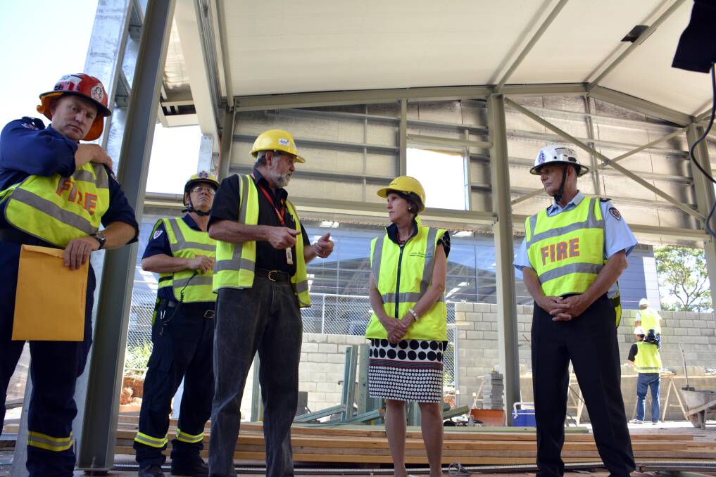 On track: Station officer Gaven Muller, project co-ordinator Stephen Hoile, member for Port Macquarie Leslie Williams and Superintendant Dave Gray at Wednesday's inspection of Port Macquarie's new fire station.