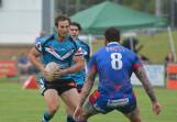 Taking on the defence: Tyrone Nelson bringing up the ball for Port Sharks in their win on Saturday over Wauchope Blues.