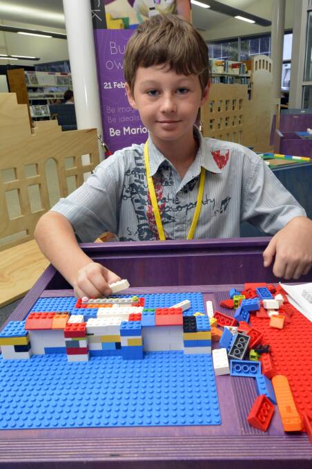 Builder in the making: Jake McDonald had a ball with the exhibition's 30,000-plus Lego bricks.