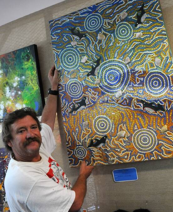 Self expression: Artist Peter Spark with his painting At the Beach at the opening of the Creatability art show at Port Macquarie Library.