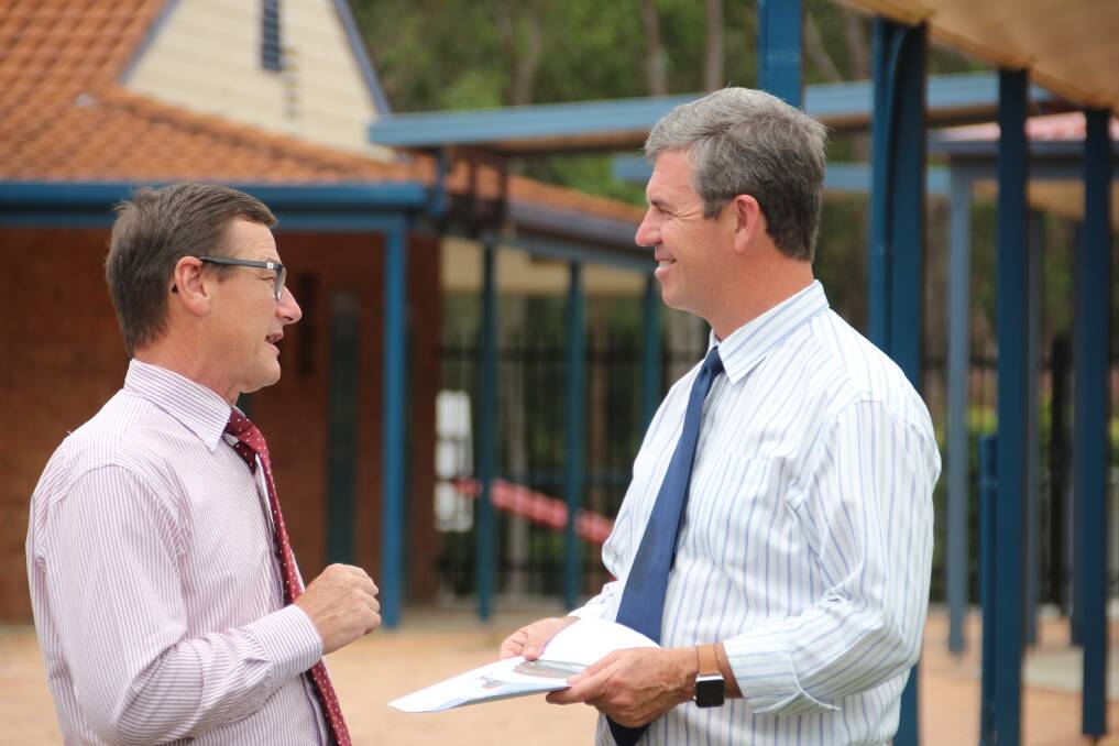 Clear future vision: Heritage Christian School principal Geoff Brisby and Lyne MP Dr David Gillespie look over plans for the school infrastructure project.