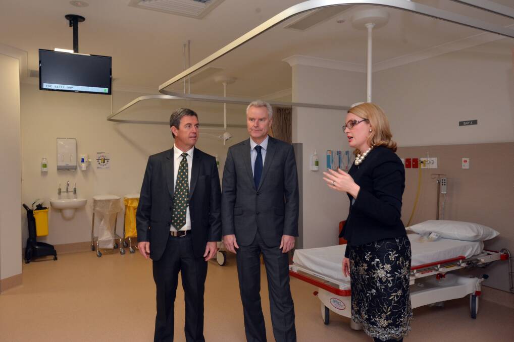 Milestone moment: Lyne MP Dr David Gillespie, Ramsay Health Care managing director and chief executive officer Chris Rex officially open the new operating theatres and day of surgery admission centre as Port Macquarie Private Hospital chief executive officer Connie Porter looks on.