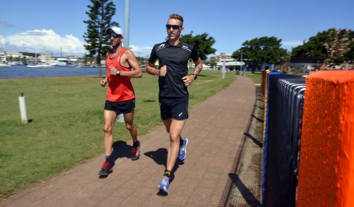 Pounding the pavement: Peter Robertson and Tim Berkel train hard during a camp at Port Macquarie this week.