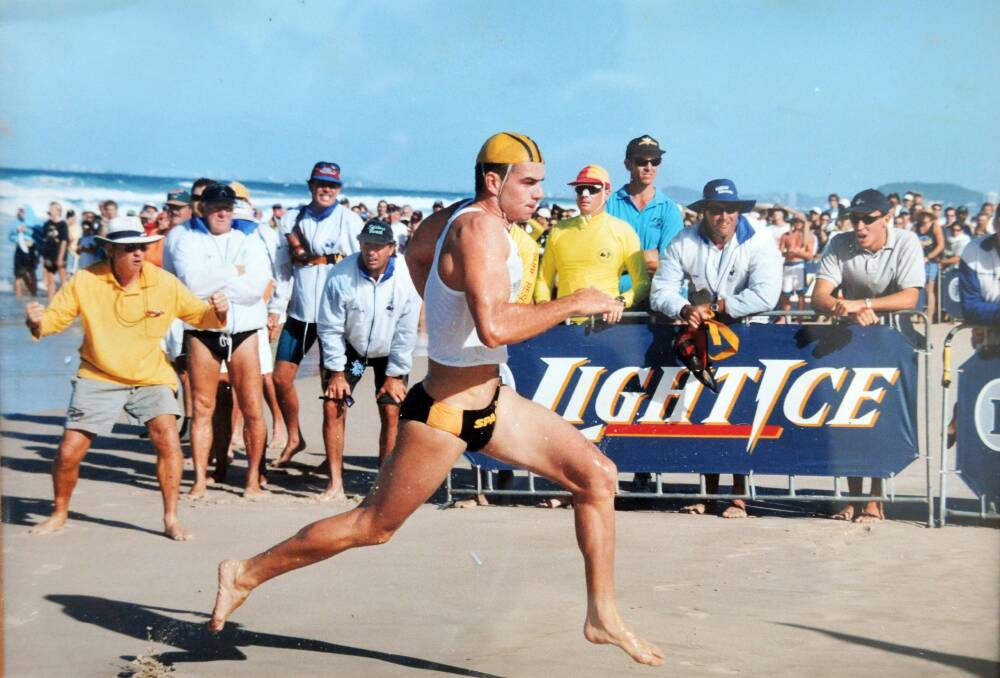 Unflagging spirit: Jim Pullen (at left with yellow shirt and white hat) cheers on his son Steven at the Australian Ironman Championships in 1999 at Kurrawa Beach; and (inset) Steve at Noosa in April this year (Inset pic courtesy of Barry Alsop EYES WIDE OPEN IMAGES).