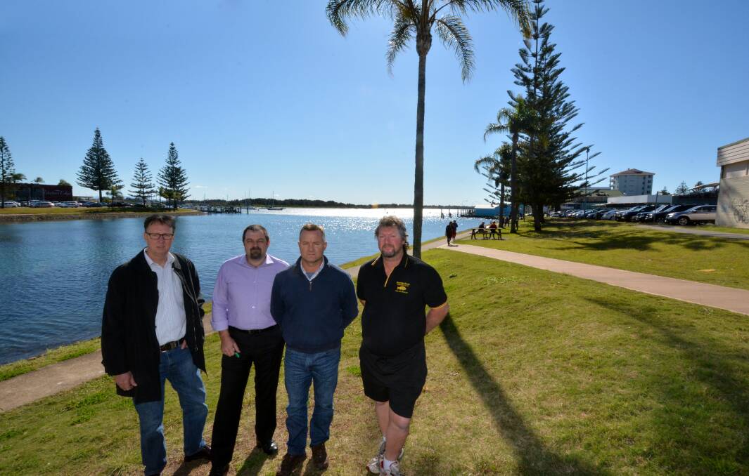 Lack of transparency: Port Macquarie-Hastings councillor Rob Turner, Gary Cuttell, councillor Mike Cusato and the Hastings River Fishermen's Co-operative's Paul Hyde are among those who have cast doubt on the process around the future sale of the Plaza car park site to Woolworths.                                                                                                  Pic: PETER GLEESON