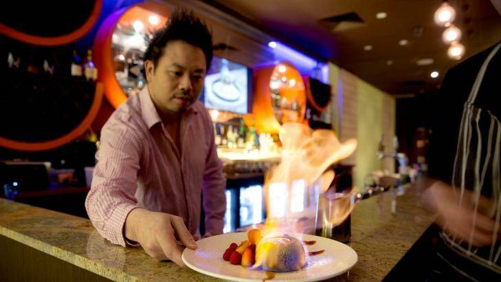 One Tea Lounge and Grill owner David Yip presents a "matcha lava bomb", a dessert dish.  Photo: Edwina Pickles