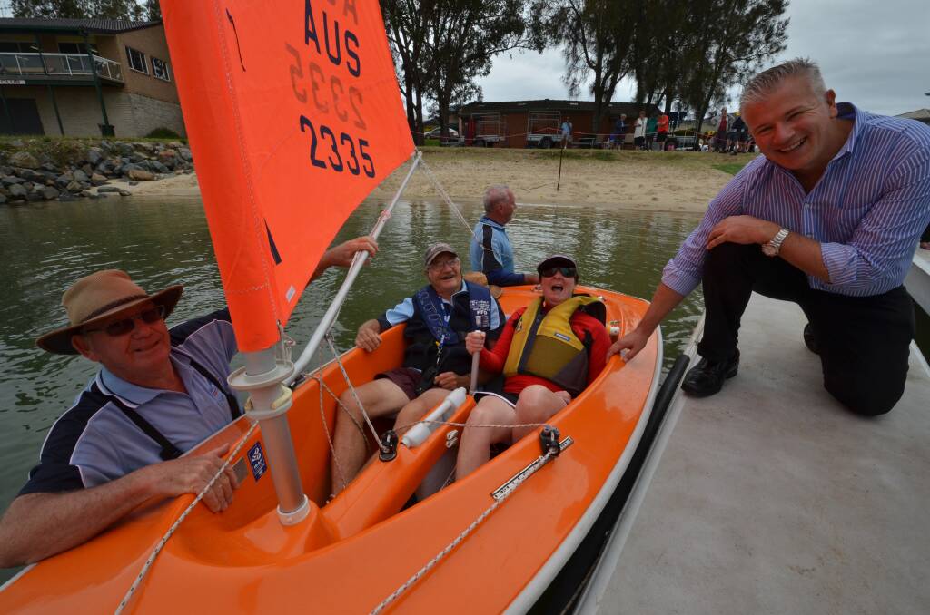 Out on the water: Sailability's Peter Gray, Jim Ringlands, Rick Ella, Kathryn Stephens and Smarter Property Group's Paul Loughland with the new dinghie.