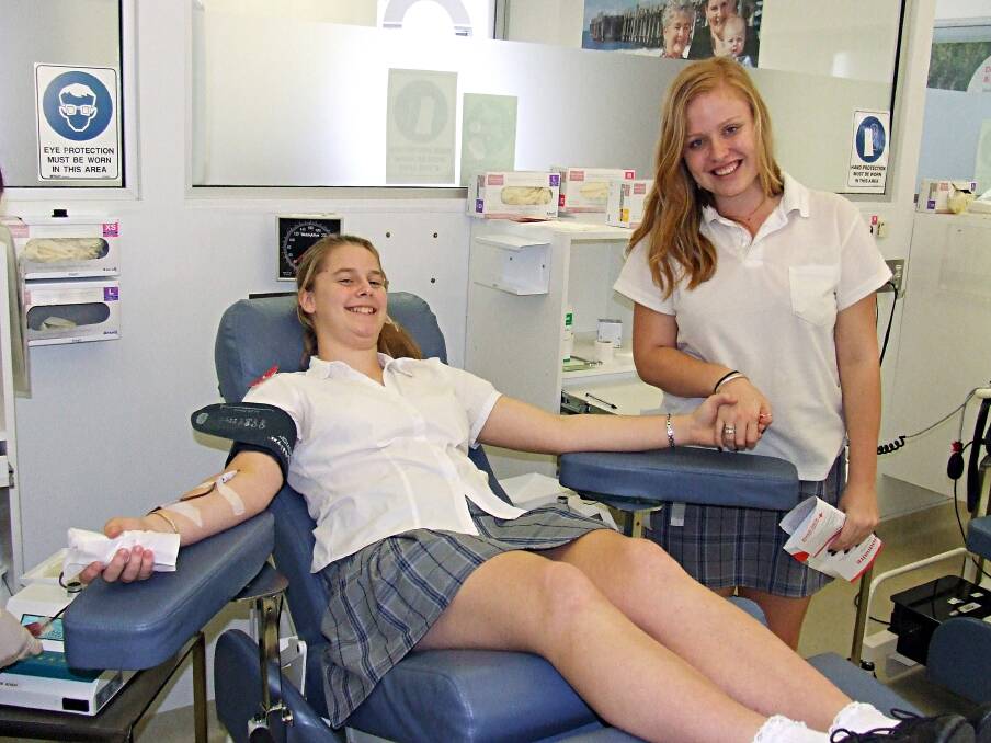Making a difference: Shanley Porto donates blood with Port Macquarie High School peer Hannah Boswell.