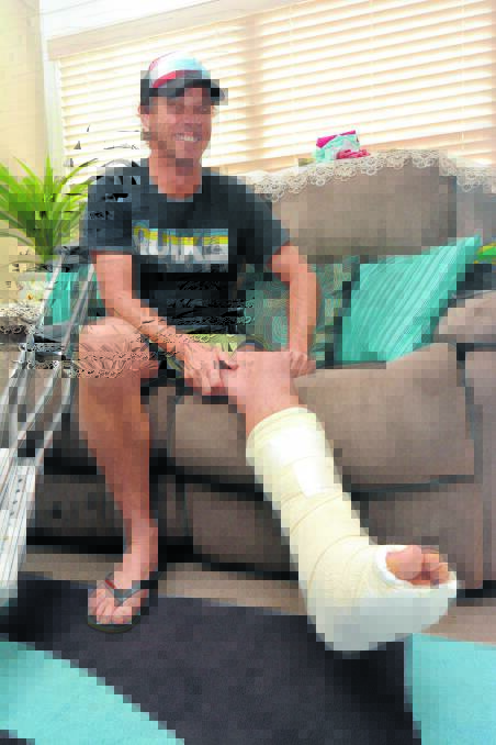 On crutches: Dean Smith is recovering from a horrible broken leg.  
Pic: PETER GLEESON