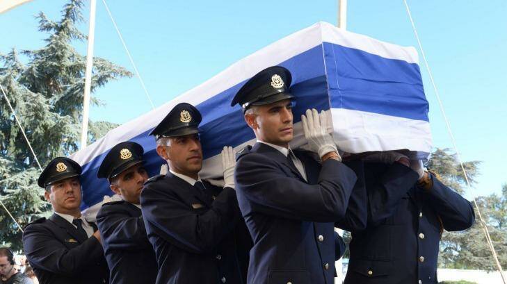 Members of a Knesset guard carry the flag-draped coffin of the former Israeli leader Shimon Peres at Mount Herzl Cemetery in Jerusalem on Friday. Photo: Israeli Government/Getty Images