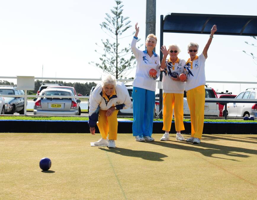 Warming up: Sylvia McCallum sends one down the green as Robyn Crosariol, Val Carroll and Yvonne Hansell watch on at Westport Bowling Club ahead of the 86th state carnival. Pic: MATT McLENNAN