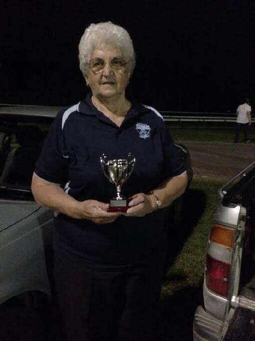 Super start to the season: Kendall Blues biggest supporter June Swan holding the nines competition winner's trophy.