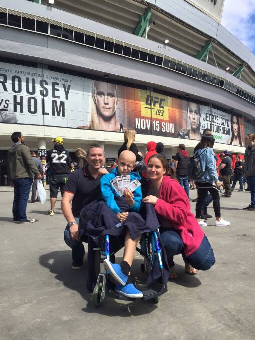 Ready to rumble: Caleb, stepdad Rob and mum Suzanne attend the UFC event in Melbourne recently.