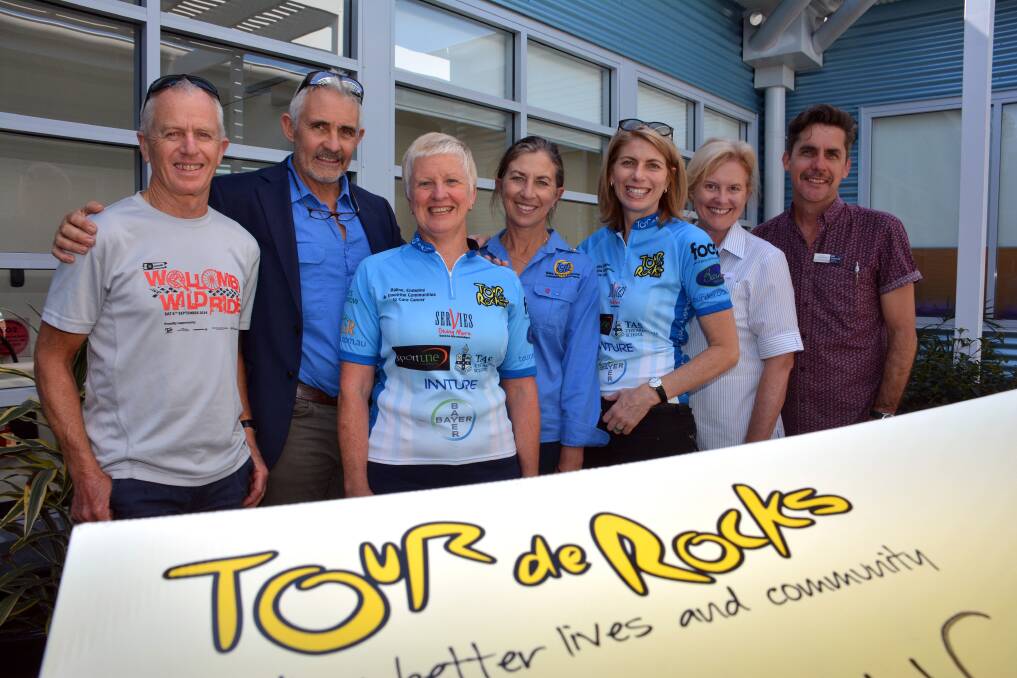 Riding for cancer: From left, Tour de Rocks Port Macquarie Peloton Princesses Dave Anderson, tour co-founder Bill Wheeler, Roz Anderson, Tonia Wheeler, Justeen Single, oncology nursing unit manager Jenny Baroutis and Eddy Godschalk at the cheque presentation.