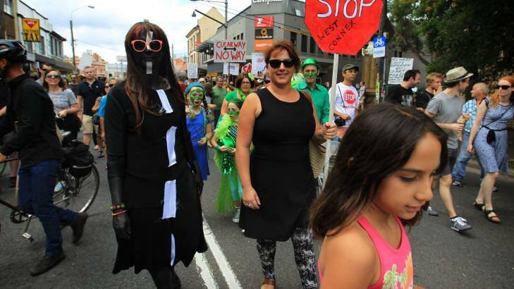 Some concerned  residents wore fancy dress as they took  the streets of Newtown, Sydney, on Sunday to protest the proposed development of the NSW government's WestConnex tunnel and road project. Photo: James Alcock