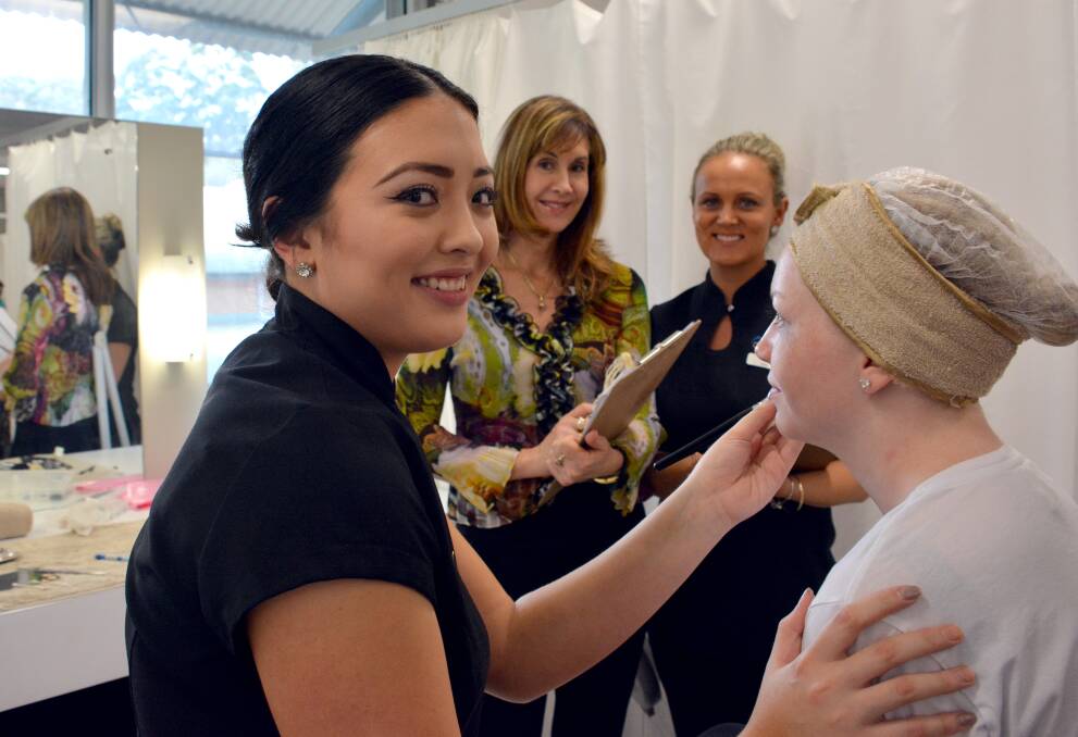 Winning ways: First place getter Annabelle Kite puts her beauty treatment skills into action with model Michaela Moore under the supervision of judges Shelley Laing and Melissa Bermingham.
