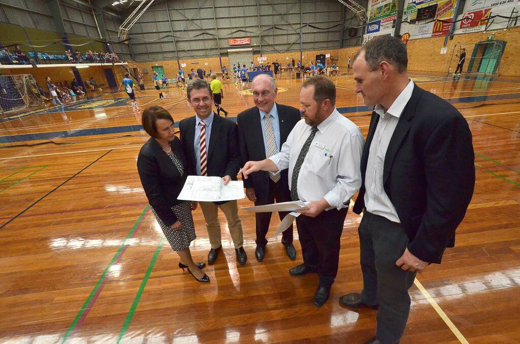 Important project: Port Macquarie MP Leslie Williams, Lyne MP Dr David Gillespie, Deputy Prime Minister Warren Truss, Port Macquarie-Hastings Council infrastructure and asset management director Jeffery Sharp and mayor Peter Besseling discuss the Port Macquarie Indoor Stadium expansion.
