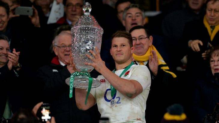 Dylan Hartley of England lifts the trophy after the final whistle. Photo: Dan Mullan