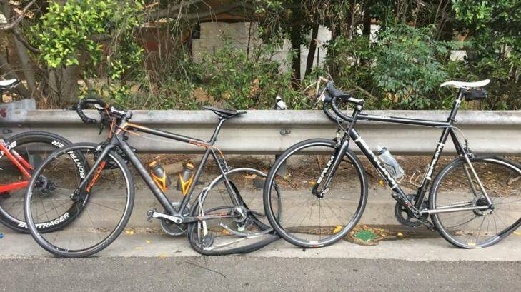 Damaged bikes propped against the road's railings. Photo: Roberto Allen