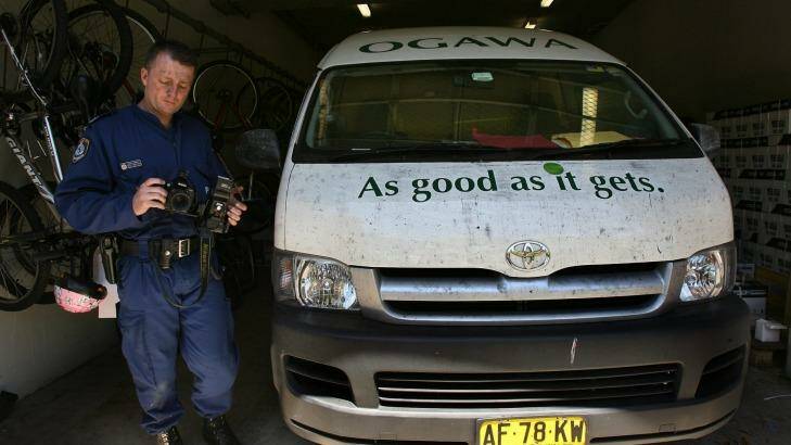 A police officer  finger printing and photographing Mr Chin's van. Photo: Kate Geraghty