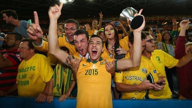 Jason Davidson of Australia celebrates with fans after Australia defeated South Korea in the 2015 Asian Cup final. Photo: Robert Cianflone