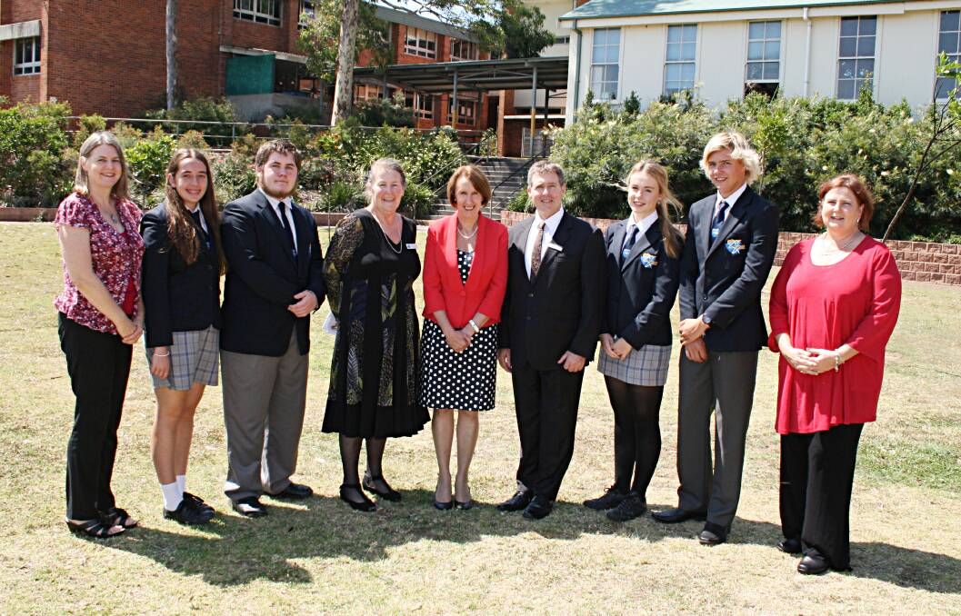 ABOVE: Newly elected: Guest from CSU Bernadette Gammon, 2015 school captains Laura Reed and Lachlan Fardy, principal Lorraine Haddon, Leslie Williams MP, Hastings College executive principal Dr Wayne Ible, 2015 vice captains Amelia Pitt and Max Lewis-Barnett and P&C Association president Leanne Burbridge gather after the recent formal school assembly at Port Macquarie High School.
