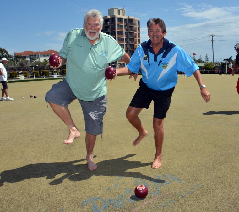 Green grass between the toes: Garry Lawler and Charlie Buchanan look forward to the Barefoot Bowls Corporate Challenge getting under way at Port City Bowling Club.