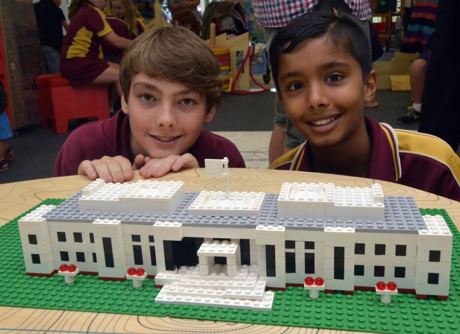 Endless possibilities: Connor Gordon and Swatip Dahal, from Westport Public School admire one of the buildings replicated from the exhibition's construction sheets.