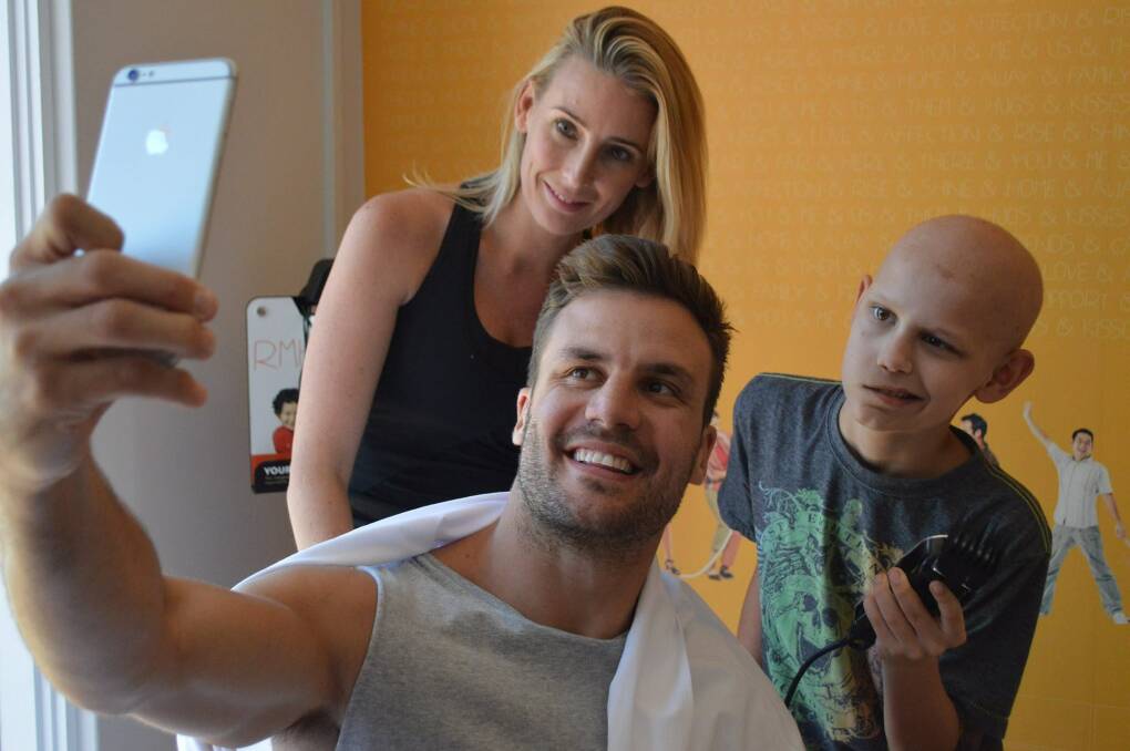Selfie time: Rugby league personality Beau Ryan let Caleb shave his head last week in a great show of support.