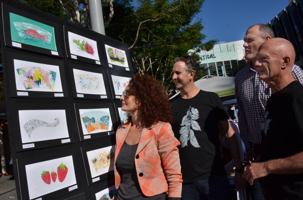 Who will win?: Tastings on Hastings coordinator Necia Waghorn, Stewart Clark of Doppio or Nothing, mayor Peter Besseling and Port Macquarie artist Jim Matsinos admire the top 20 finalists they chose from entries in the Tastings on Hastings BioCup Art Series contest.