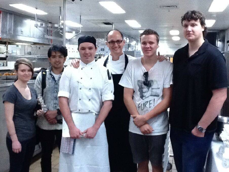 Inspiration for the future: Port Macquarie TAFE's silver medal winning team Nicola Langman and Joe Soliman (far left) and Max Bean and Jacob Palmer (far right) saw a large-scale kitchen in action when they visited former TAFE student Sean Page and executive chef Tamas Pamer at the Intercontinental Sydney.