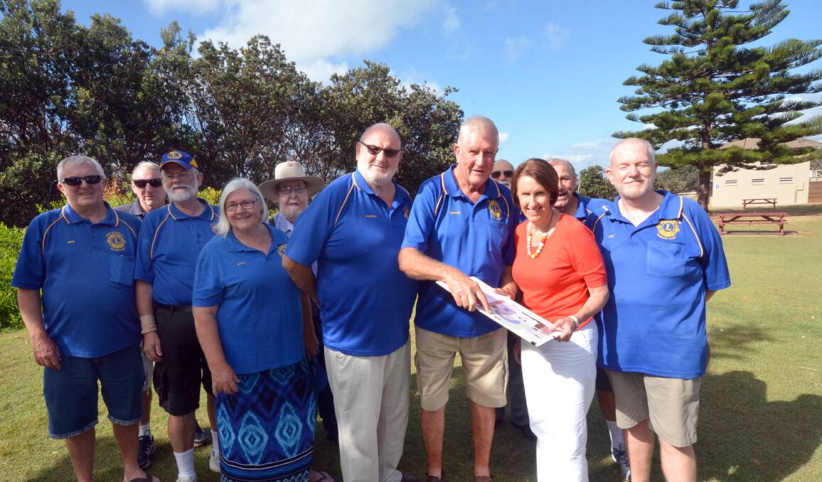 Funding boost: Port Macquarie MP Leslie Williams (third from right) looks over plans for the Lighthouse Beach Reserve improvements with Tacking Point Lions Club members Jeff Woodgate, Simon Abell, Geoff Best, Kathy Moonen, Neil Tubb, Malcolm Merrick, Duncan Wyndham, Fred Hynes, Tony Boyd and Stuart Aston.