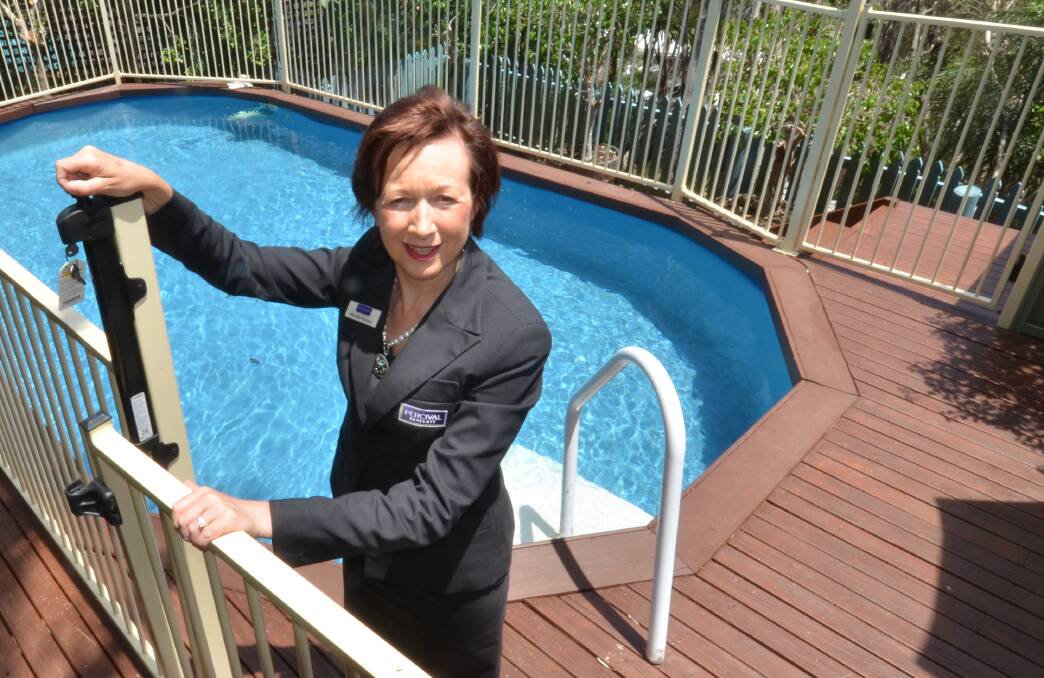 Safety test: Property agent Michelle Percival urges all property owners planning on selling or leasing their home to ensure their backyard pools are compliant like the one pictured here which meets Australian Standards for safety.