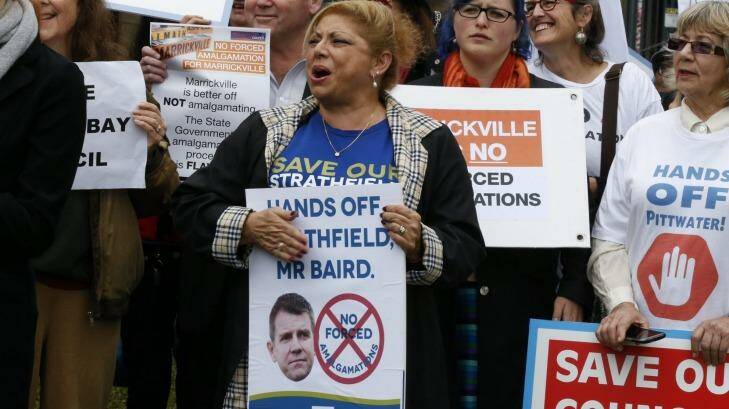 Protesters rally against forced amalgamations. Photo: Peter Rae 