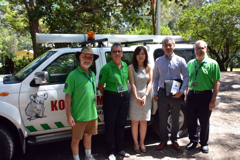 Supporting conservation: Mitsubishi Australia's (centre) Rie Nakamura and (second from right) Nobu Hirota learn more about Port Macquarie Koala Hospital from Mick Feeney, Jane Duxberry and Bob Sharpham.