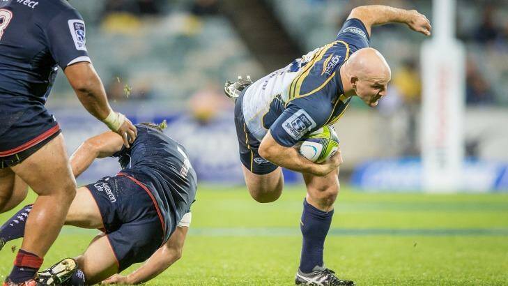 Hooker Stephen Moore of the ACT Brumbies stumbles in the slippery conditions. Photo: Matt Bedford