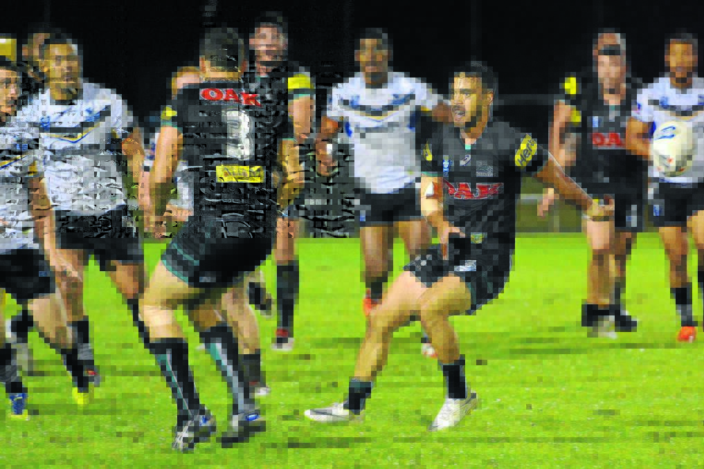 Clever pass: Isaac John flicks one out the back on Saturday night in a match between Penrith Panthers and Wentworthville Magpies.  
Pic: MATT ATTARD