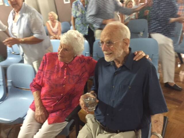 Proud moment: Author Tom Hearle with wife Bo at the launch of his book "Still Air at Dawn".