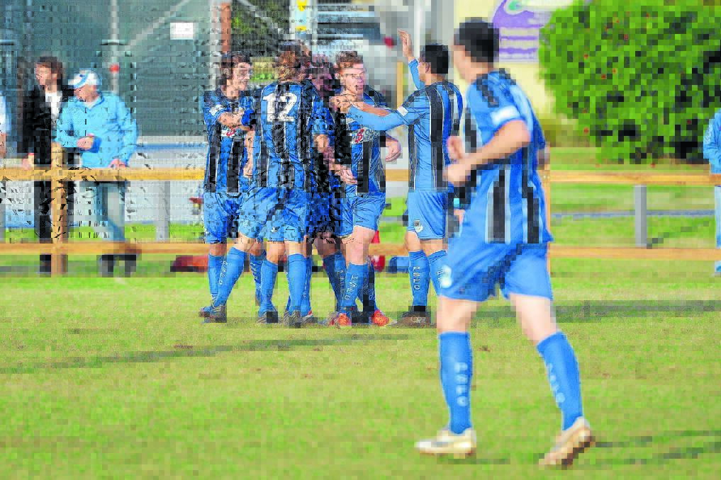 High fives all round: Port Saints celebrate Michael Bishop's goal in the second half on Saturday against Old Bar.
