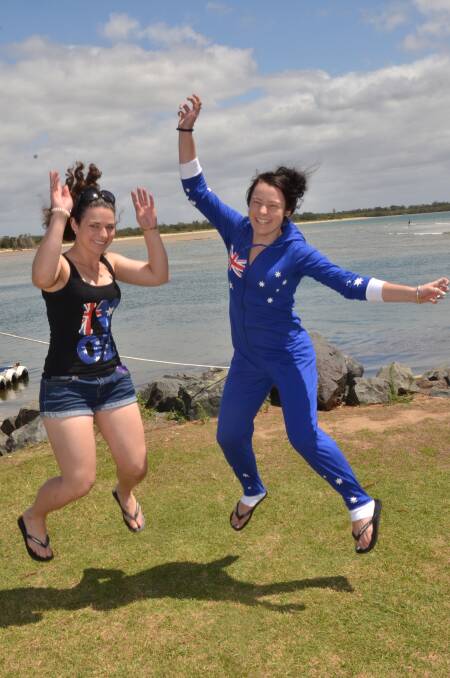 Jumping good time: Sisters Karen and Rebecca Mepham show their Aussie pride for Australia Day.