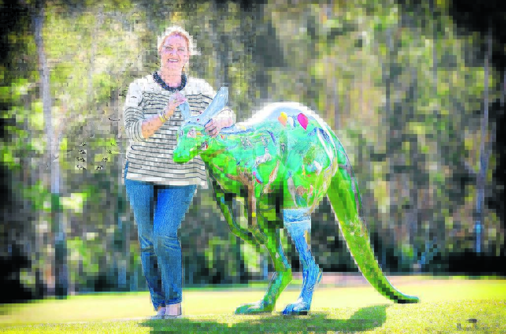 Meet Rocco: Rocco the roo with its painter, Port Macquarie artist Pauline Roods.