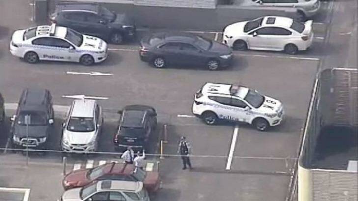 Police at the scene of a shooting at a Sydney shopping centre. Photo: Channel Nine screen grab