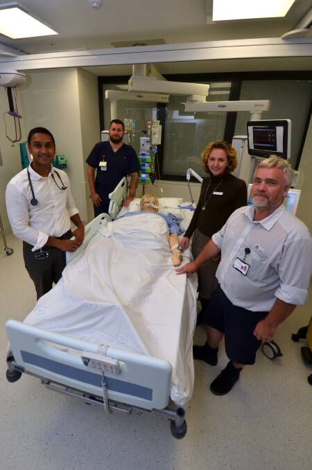 Compassionate approach: Dr Kishore Sanghi, registered nurse Matt Cox, Organ and Tissue Donation Service NSW co-state medical director Dr Elena Cavazzoni and Port Macquarie Base Hospital intensive care unit nursing unit manager Patrick Regan with a simulation mannequin during the simulation exercise.