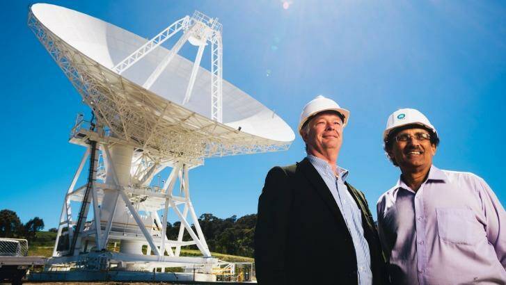 Canberra's deep-space communication station director Ed Kruzins (left) and NASA's network director Al Bhanji in front of the new antenna in Tidbinbilla. Photo: Rohan Thomson