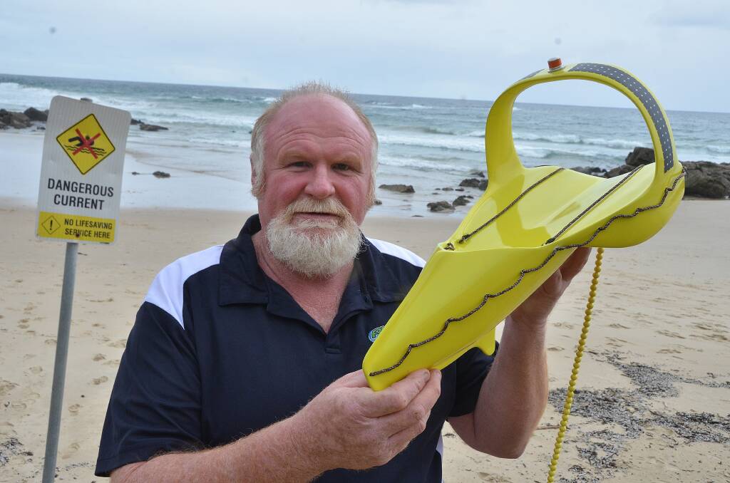 A new-look lifesaver at our beaches: Neil Wallace with a model of his Rip Bouy designed to rescue people caught in rips at the beach.