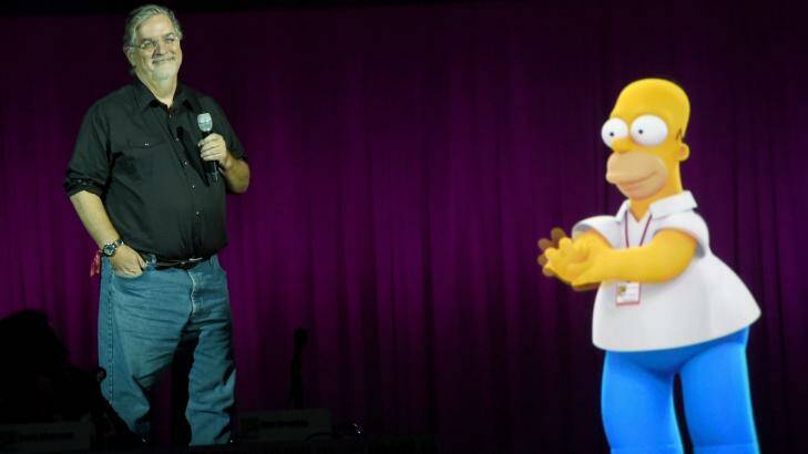Homer help ... Matt Groening takes questions on plans for a Simpsons/Family Guy crossover episode with a little assistance from his most famous creation.