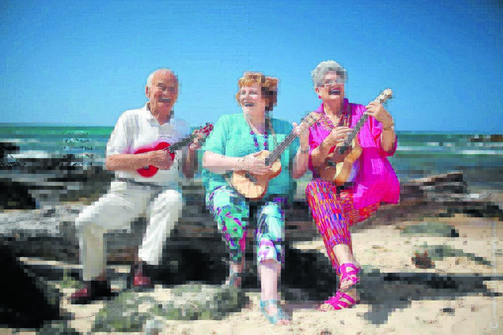 Showing how it's done: Charlie Clark, Jenny Mills and Carole Field play a tune with their ukuleles.
